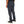 Dark gray pants worn by a person on a white background