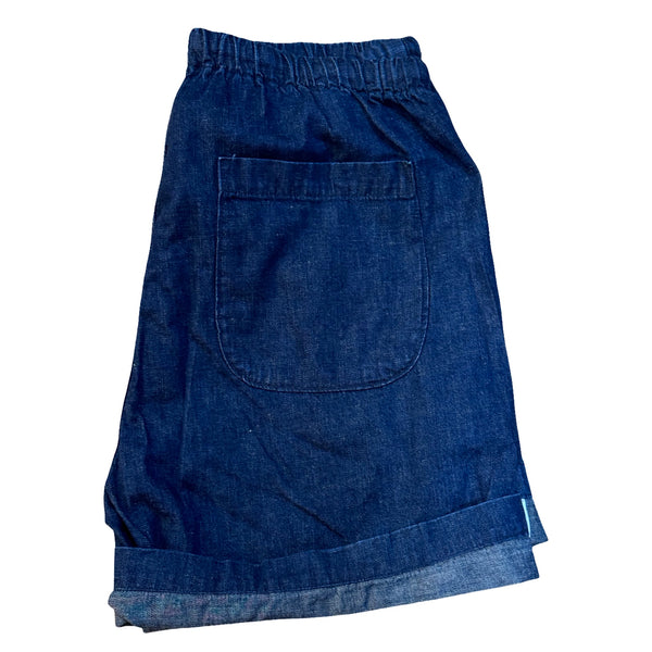 Blue denim shorts on a white background