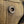 Close-up of a textured fabric surface with a decorative button.